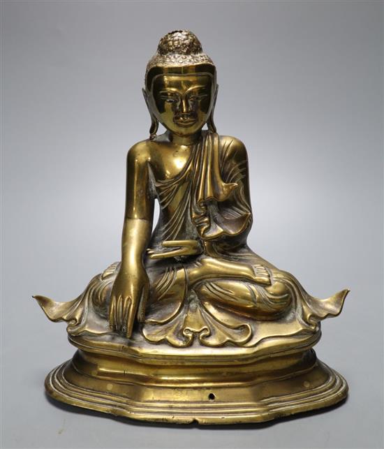 A 19th century Chinese bronze seated figure of Buddha Shakyamuni, seated on plinth, height 21cm